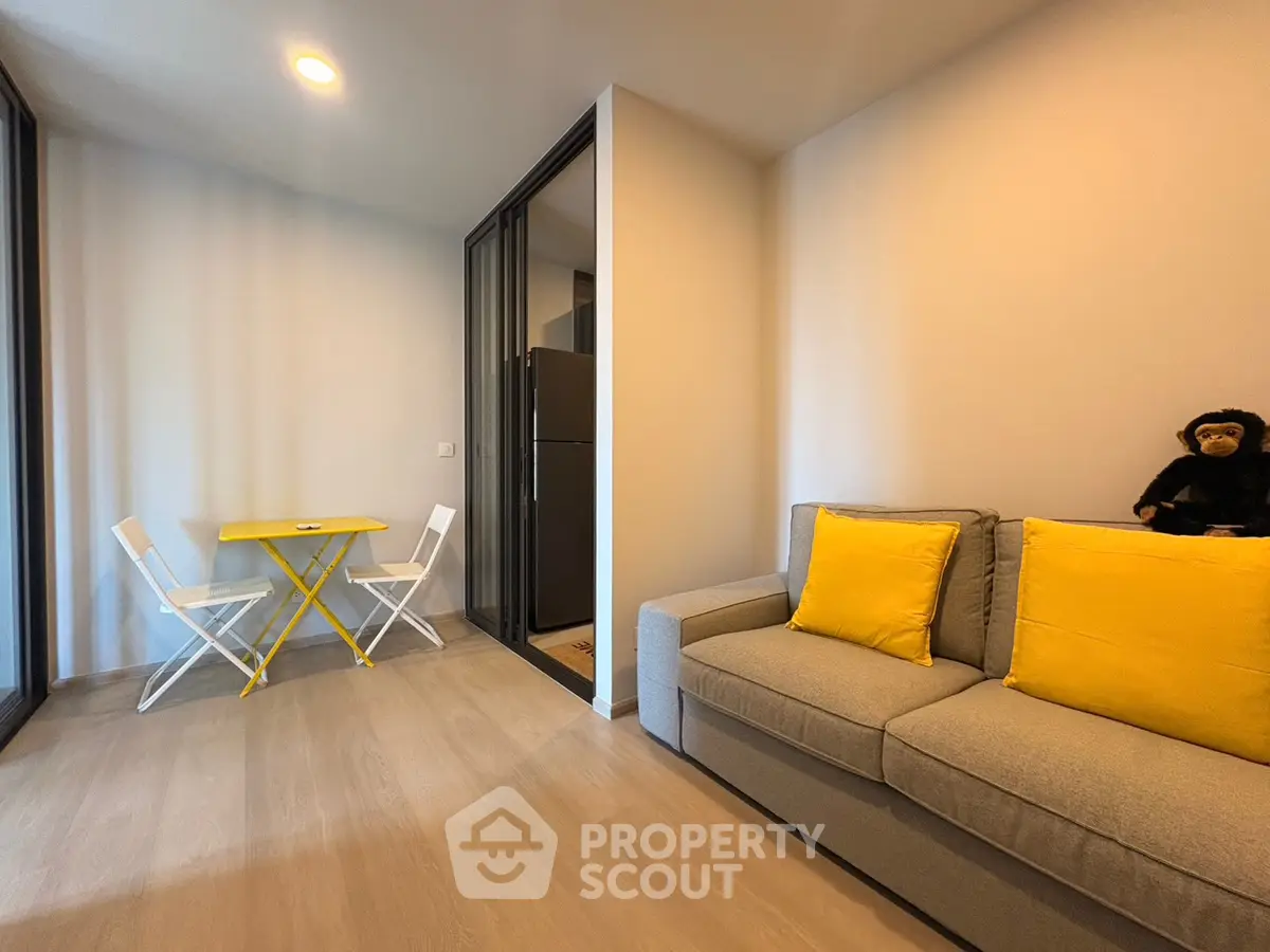 Modern living room with yellow accents and cozy seating area