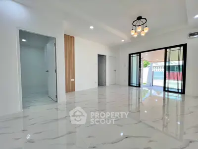 Spacious modern living room with marble flooring and elegant lighting