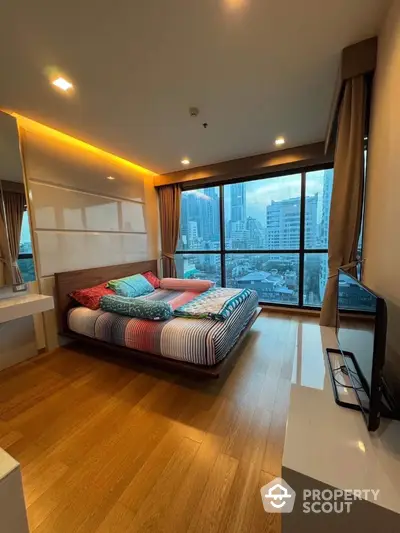 Luxurious bedroom with stunning city view and modern decor