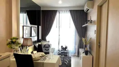 Modern living room with elegant dining setup and stylish decor