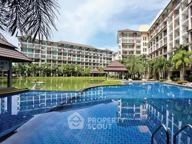 Luxurious condominium with stunning pool and lush garden view.