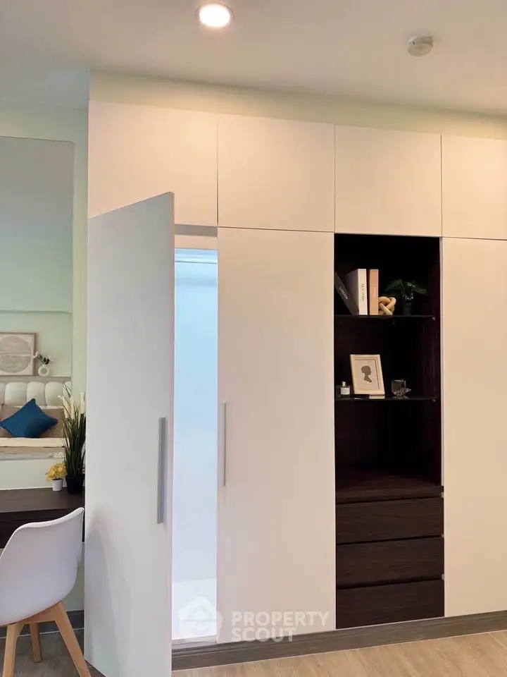 Modern bedroom with sleek built-in wardrobe and stylish decor