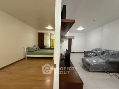 Spacious studio apartment with modern furnishings and open layout