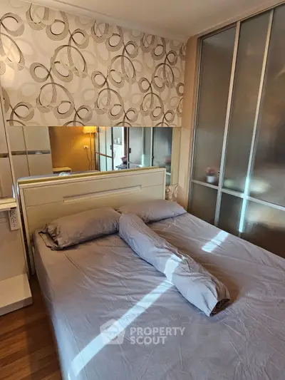 Cozy bedroom with modern decor and sliding closet doors