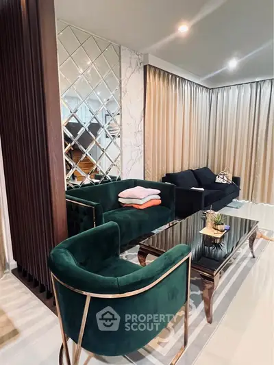 Luxurious living room with elegant green velvet chairs and modern decor