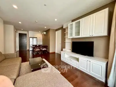 Spacious living room with elegant furniture and open layout in modern apartment.