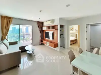 Spacious modern living room with city view, open layout, and elegant furnishings.