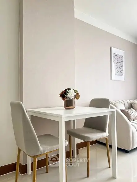 Modern minimalist dining area with elegant decor and cozy seating