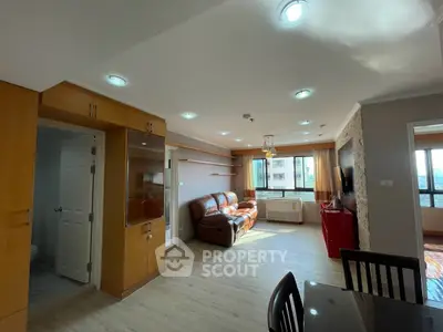Spacious living room with modern furnishings and natural light