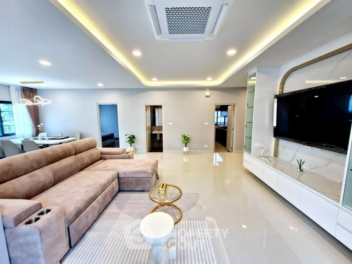 Spacious modern living room with elegant decor and large sectional sofa