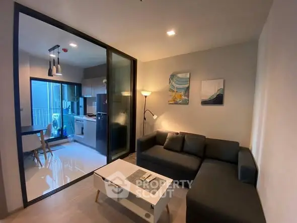 Modern living room with open kitchen and stylish decor