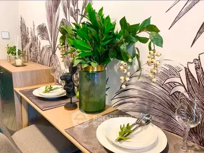 Stylish dining area with elegant table setting and lush greenery decor