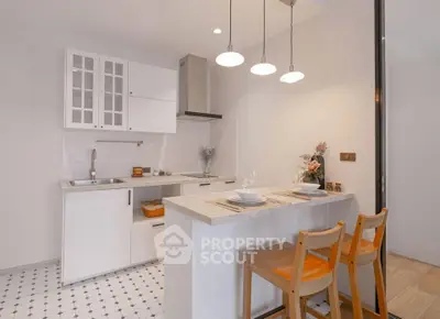 Modern kitchen with open layout and stylish breakfast bar seating