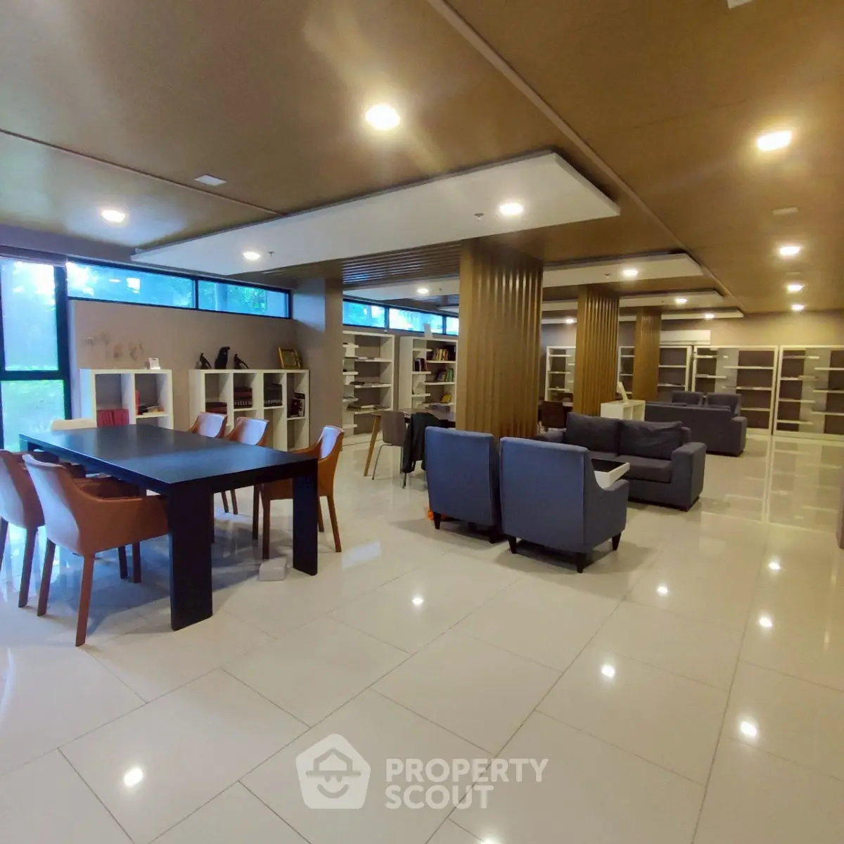 Spacious modern library with elegant seating and ample natural light.