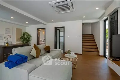 Spacious living room with modern decor and cozy seating area