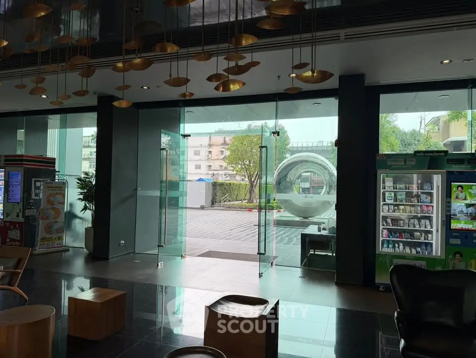 Modern building entrance with sleek design and vending machines