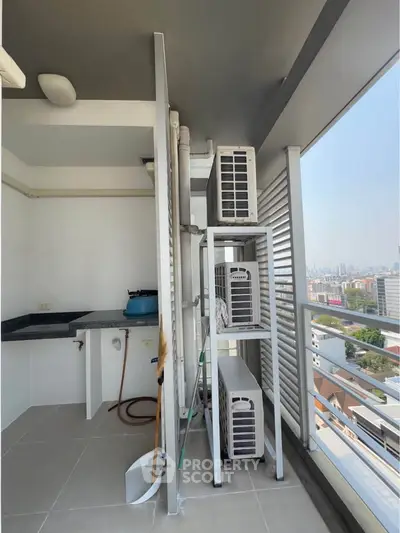High-rise balcony with city view and air conditioning units, perfect for urban living.