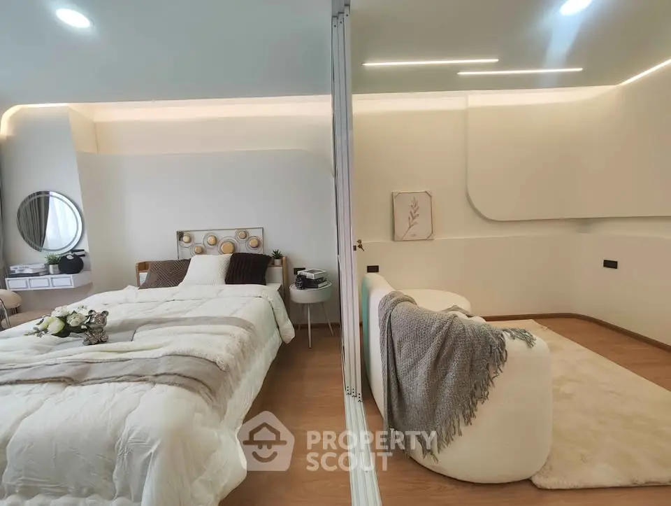 Luxurious modern bedroom with elegant decor and cozy seating area