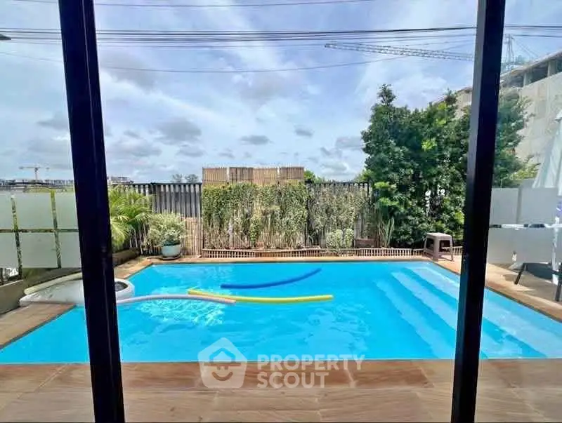 Luxurious private pool with serene garden view, perfect for relaxation and entertainment.