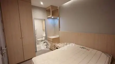 Modern bedroom with ensuite bathroom and built-in wardrobe