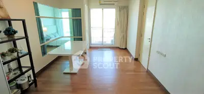 Spacious apartment with modern decor and large windows offering ample natural light.