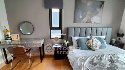 Stylish bedroom with modern decor, featuring a cozy bed and elegant workspace.