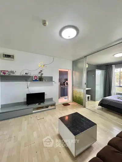 Modern open-plan living room with sliding doors and stylish decor