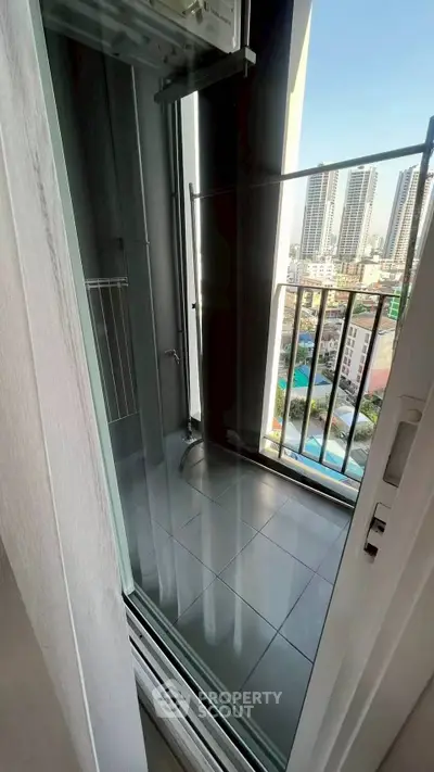 Modern balcony with city view in high-rise apartment