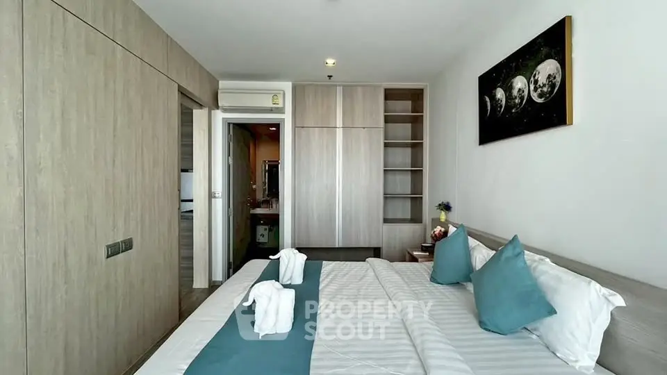 Modern bedroom with stylish decor and ample storage space