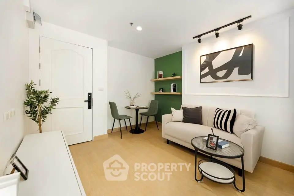 Modern living room with stylish decor and cozy seating area, perfect for relaxation and entertaining.