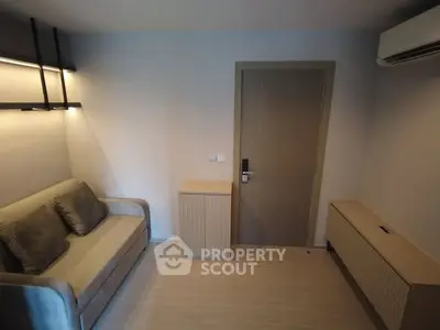 Cozy modern living room with sofa and air conditioning