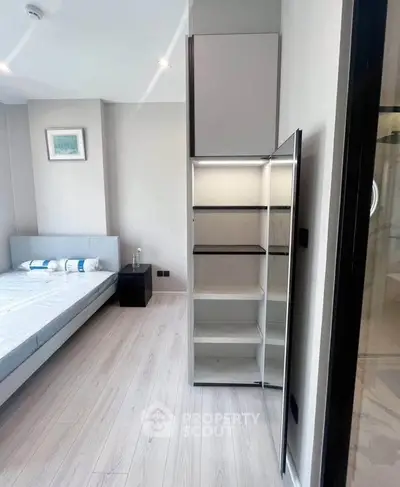Modern bedroom with sleek storage and minimalist design