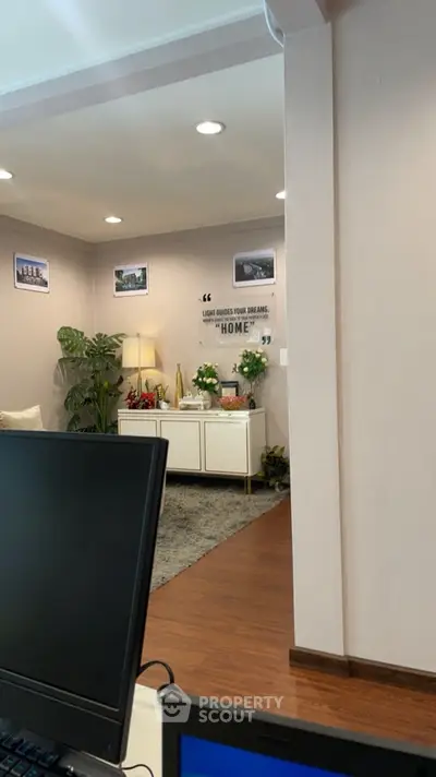 Cozy living room with stylish decor and modern lighting, perfect for relaxation and entertaining.