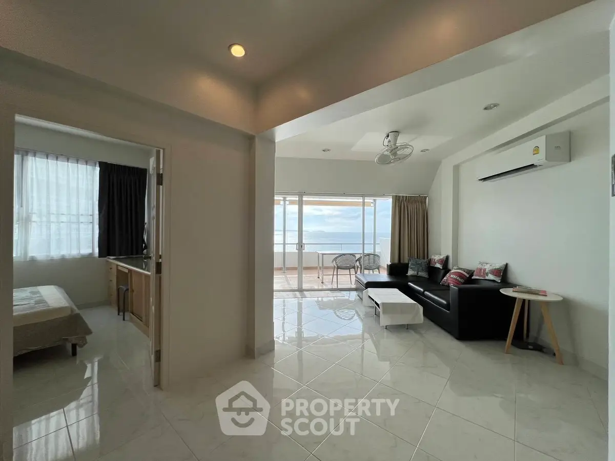 Spacious living room with ocean view and modern furnishings