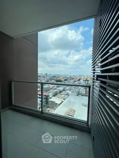 Spacious balcony with stunning city view, perfect for relaxation and enjoying the skyline.