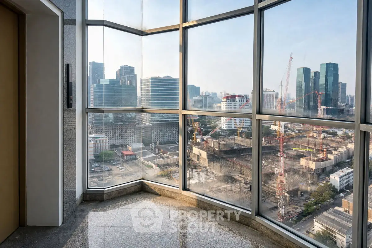 Stunning cityscape view from high-rise building with floor-to-ceiling windows