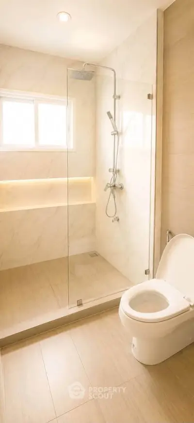 Modern bathroom with glass shower and elegant tile design