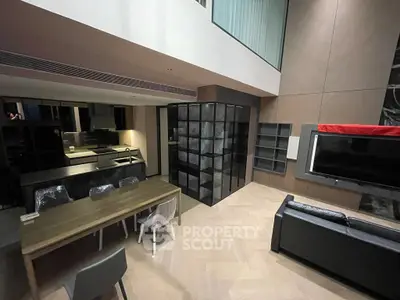 Modern living room with open kitchen and stylish furniture