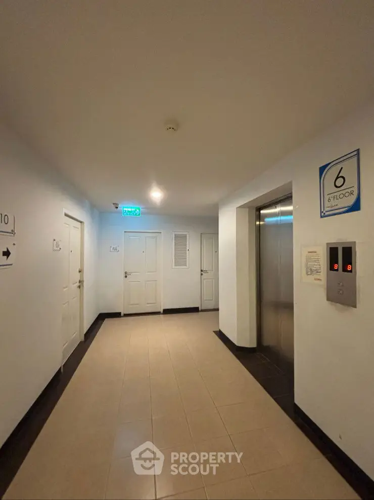 Modern building elevator lobby on the sixth floor with clean design and bright lighting.