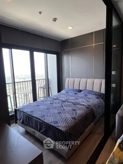 Modern bedroom with large windows and balcony view