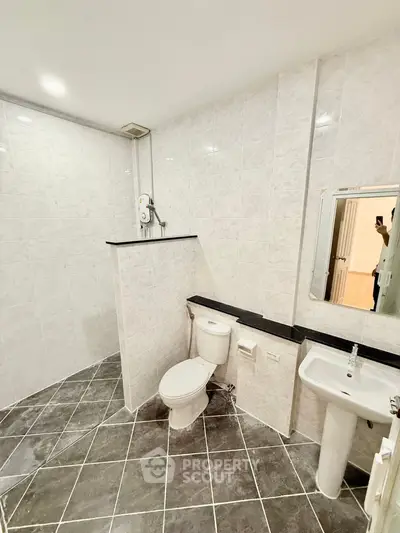 Spacious modern bathroom with sleek tiles and elegant fixtures