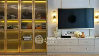 Luxurious living room with elegant cabinetry and modern TV setup