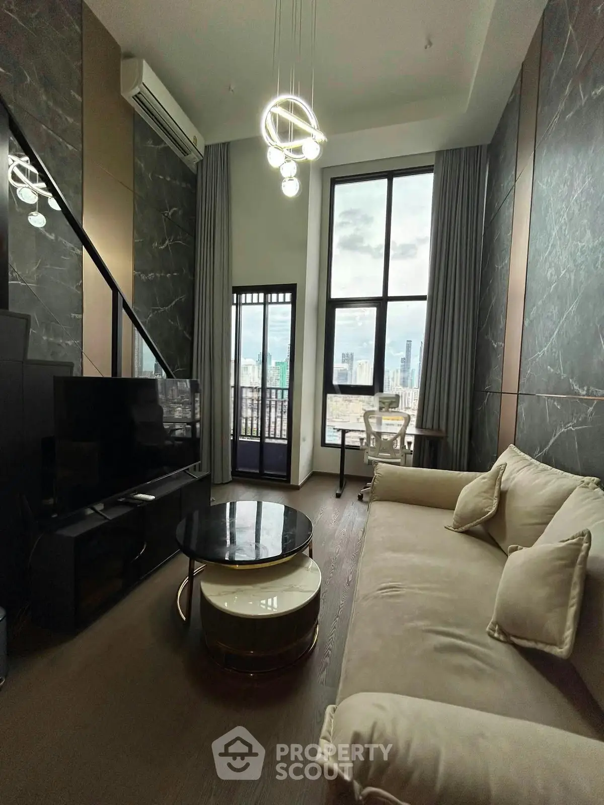 Luxurious high-rise living room with modern decor and stunning city view