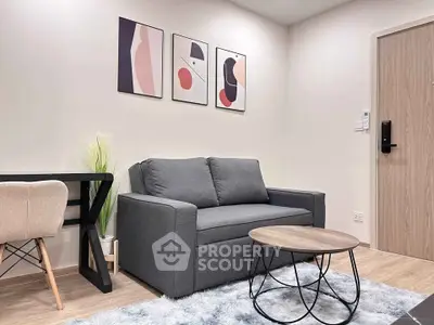 Modern living room with stylish sofa, abstract art, and cozy decor