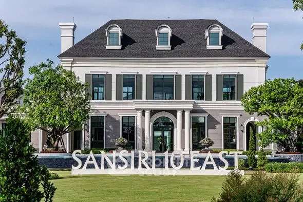 Luxurious mansion exterior with elegant architecture and lush landscaping at Sansiri 10 East.
