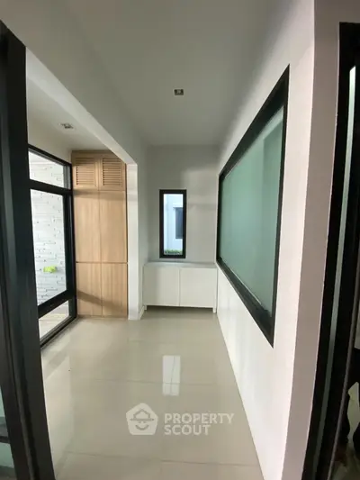 Modern hallway with sleek design and natural light