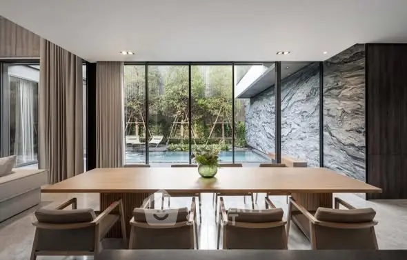 Luxurious dining area with pool view and modern design