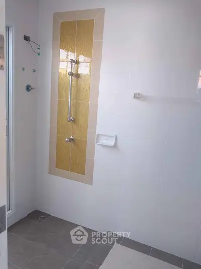 Modern bathroom with stylish tile design and shower area