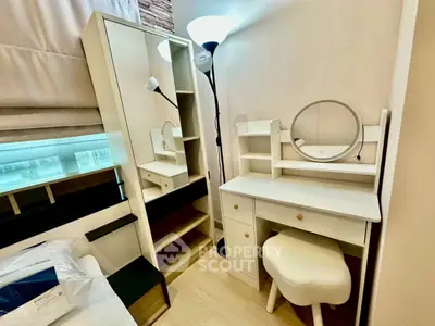Cozy bedroom corner with stylish vanity and ample storage