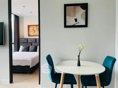 Modern apartment interior with stylish dining area and cozy bedroom view.